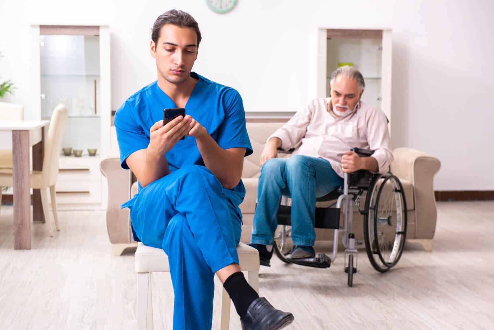 Old,Man,In,Wheel-chair,And,Young,Bad,Caregiver,Indoors